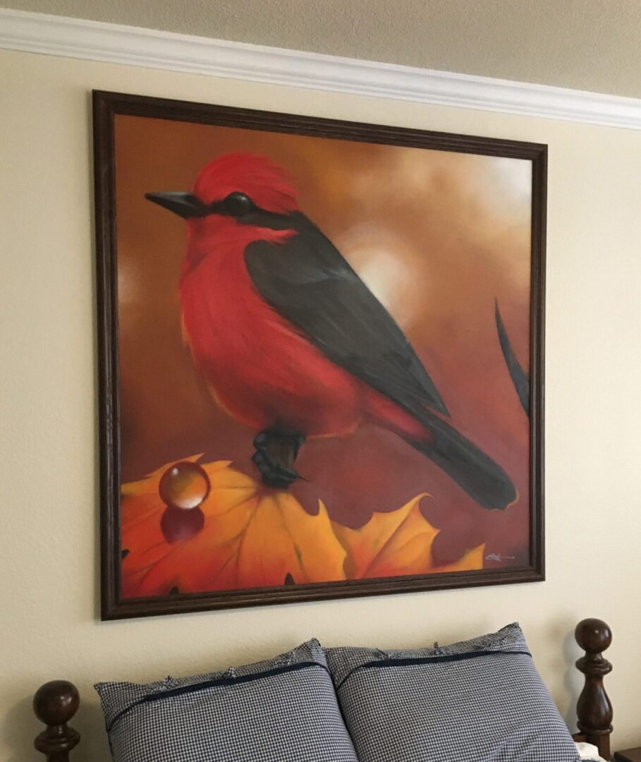 A painting of a red bird on top of leaves.