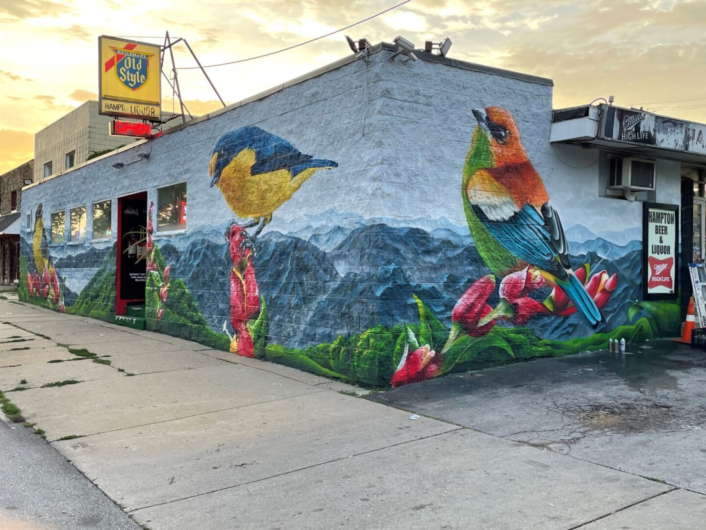 A building with a mural of birds on it.