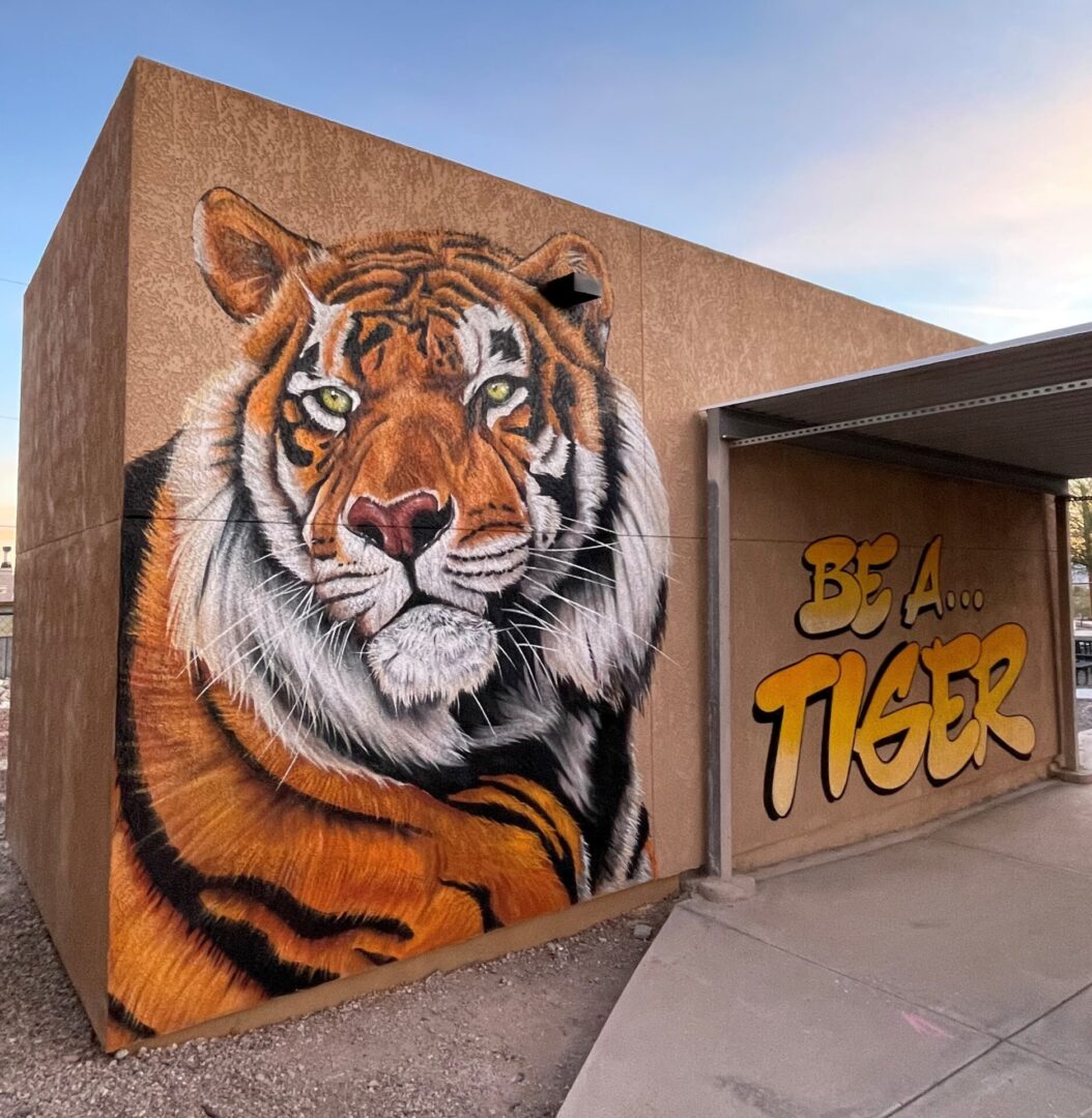 A mural of a tiger on the side of a building.